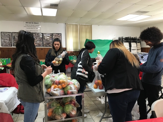 Pacific Workers' Compensation staff volunteering at Fishes & Loaves