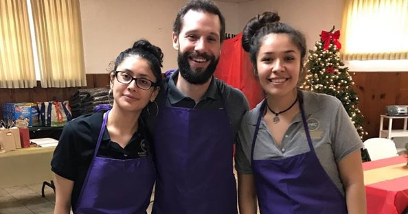 Pacific Workers' Compensation managing attorney Bilal Kassem and two members of our Case Management team volunteer with Fishes & Loaves. 