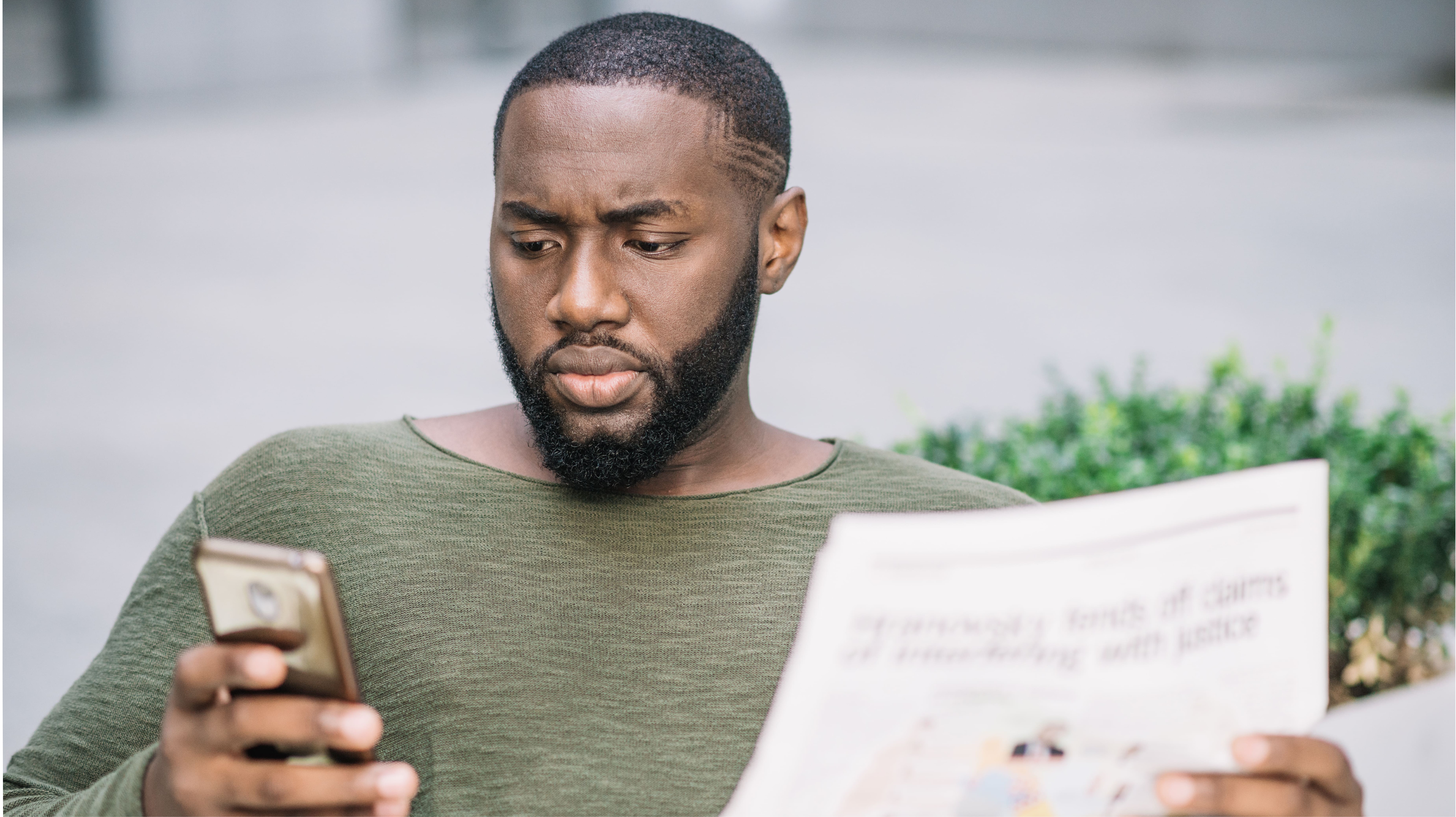 man-watching-legal-scam-on-his-phone