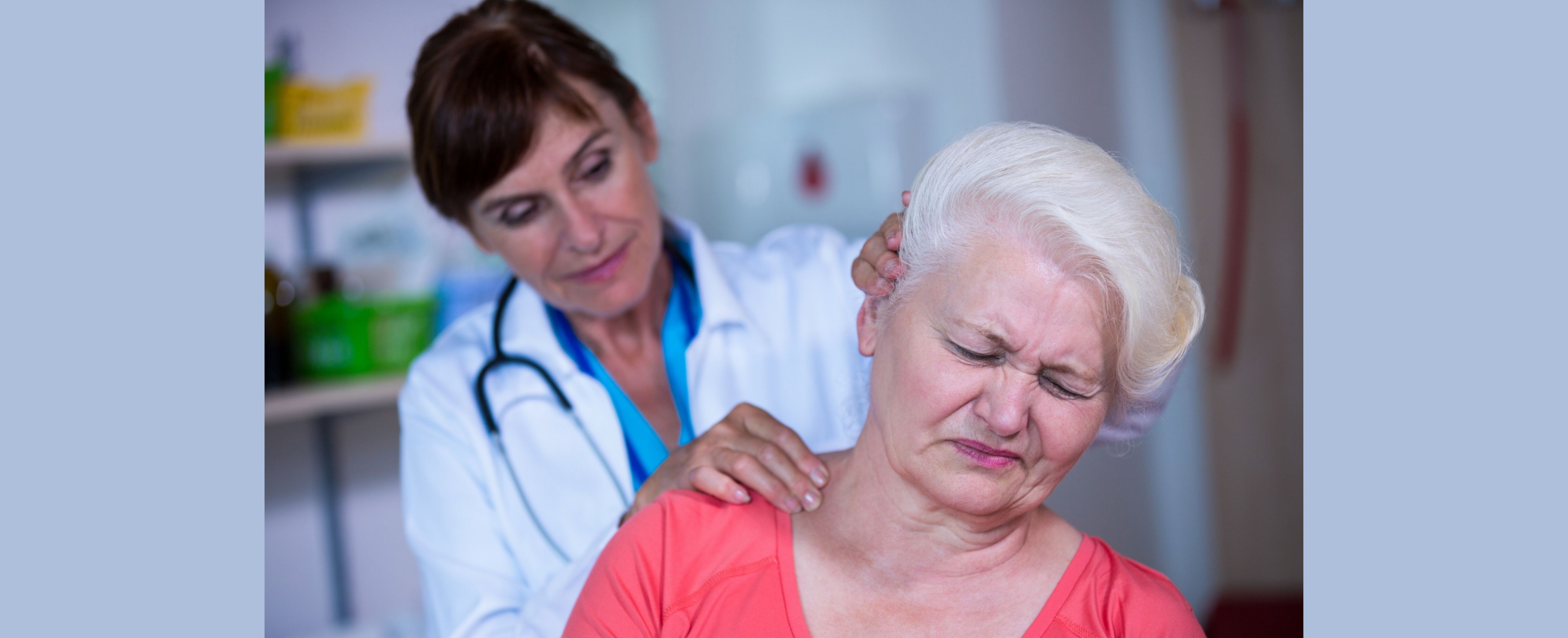 Woman at doctor for shoulder injuries and treatment