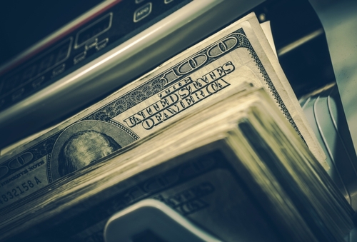 Banking Theme. American Dollar Banknotes Inside Bill Counter Close Up Photo.