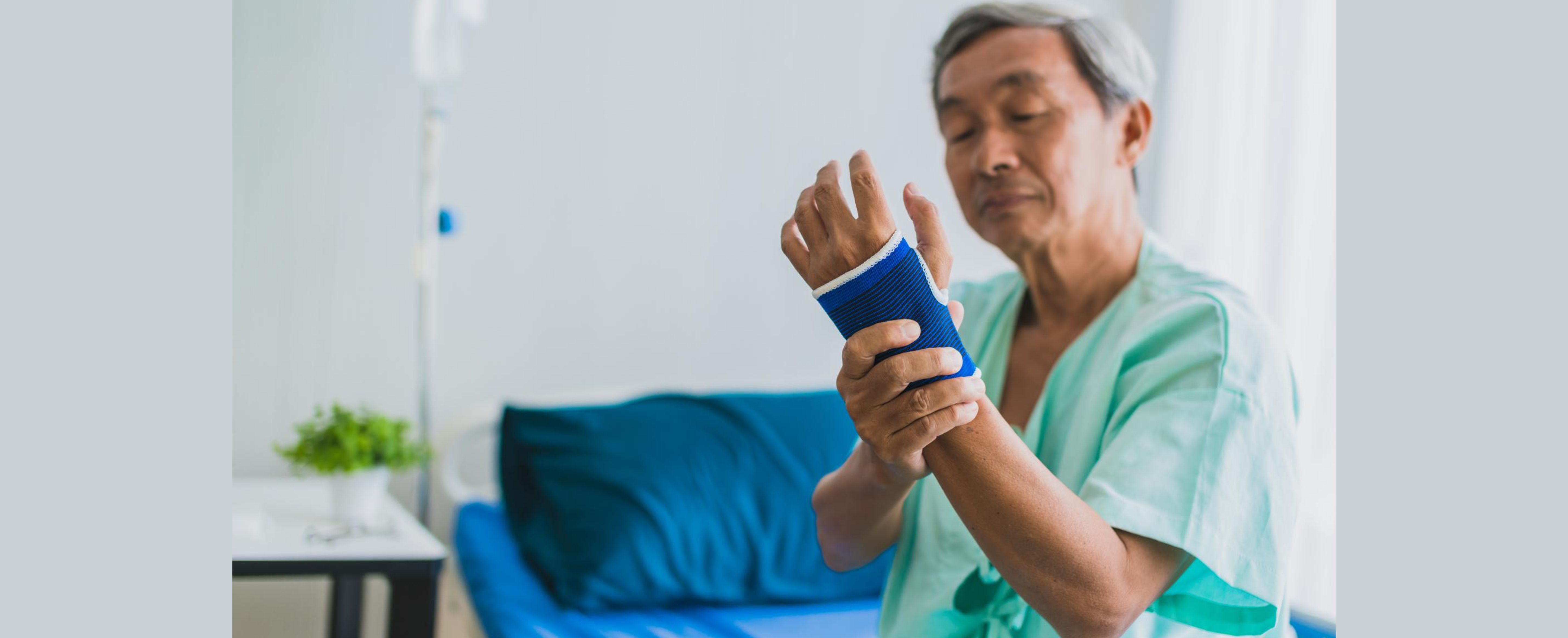 Worker holding his writs due to hand injury